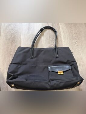 Tumi Black Tote with Gold Hardware and Front Pocket